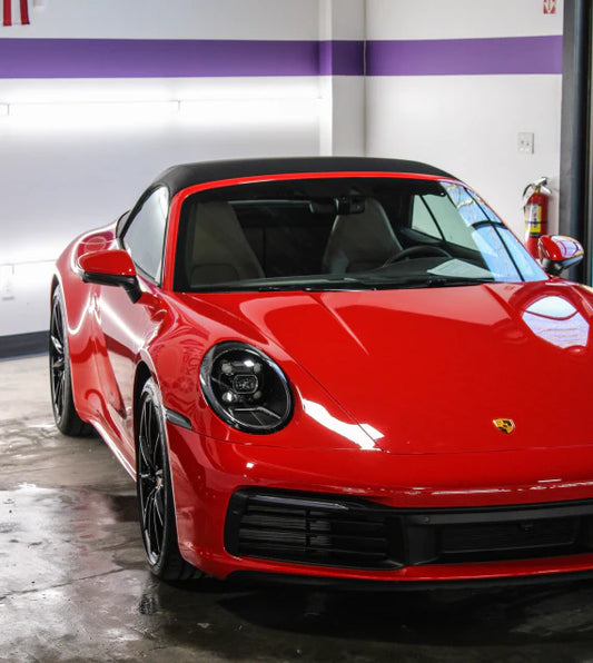 image of a red Porsche to convey our emotional attachment cars